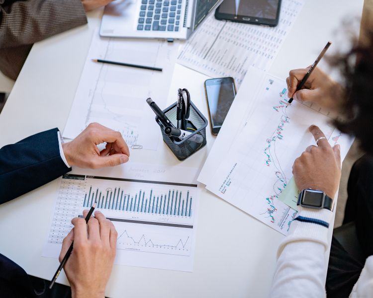 Professionals reviewing project cost and financial information