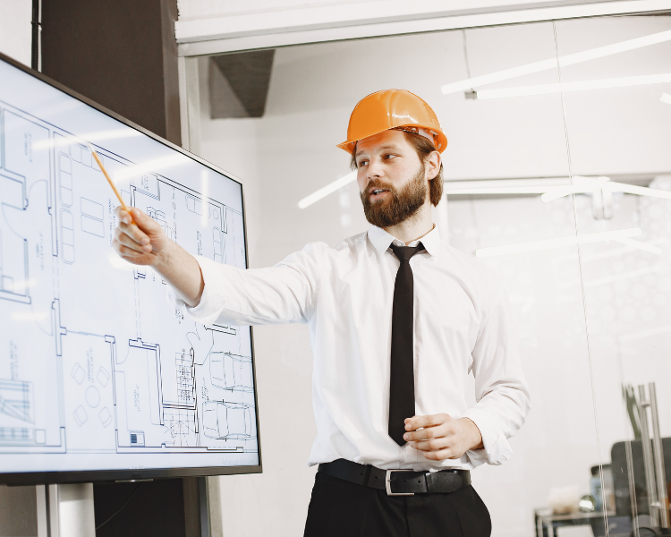 Construction professional presenting digital project drawings